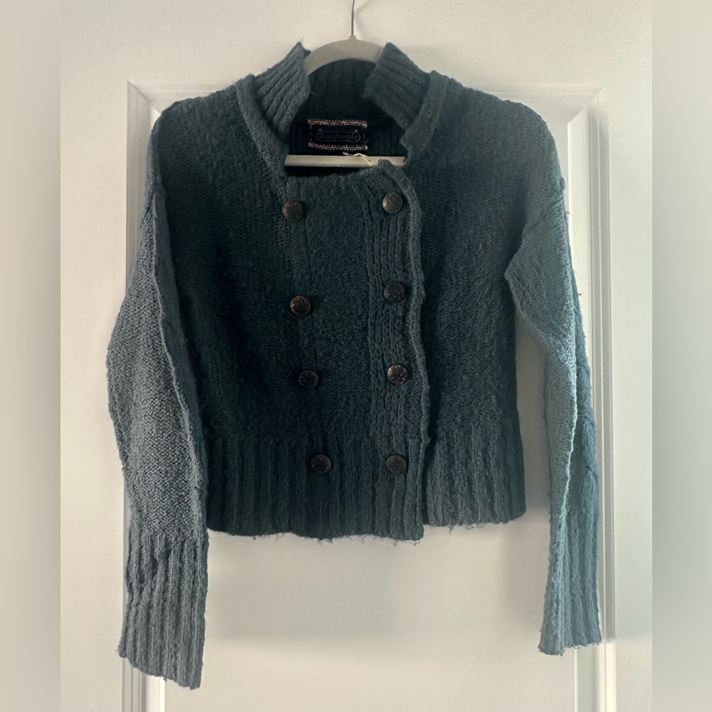 Free People woman’s cropped sweater.